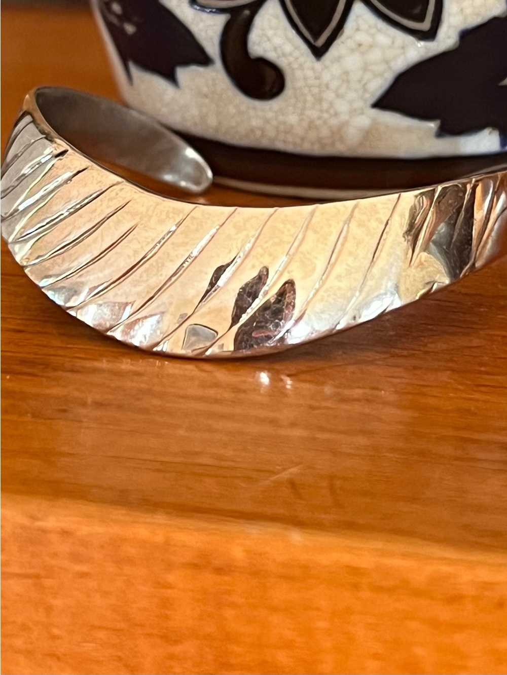 Silver tone diagonal ribbed texture curved cuff bracelet